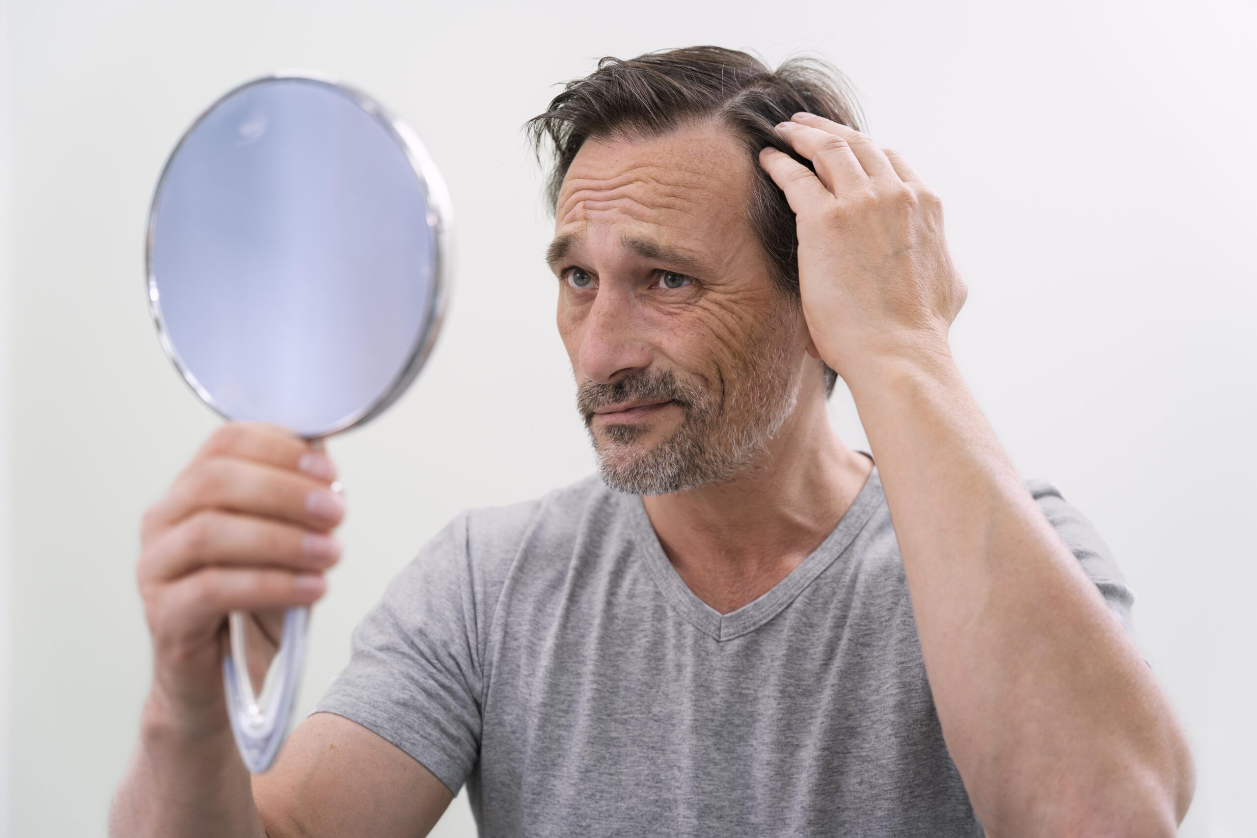 man getting hair loss treatment