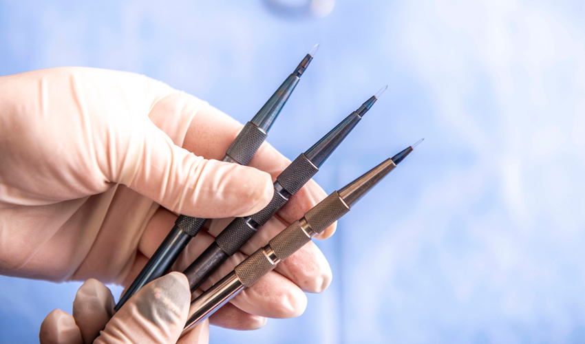 Sapphire FUE blade and implanter pen used during a hair transplant procedure at Hairpol
