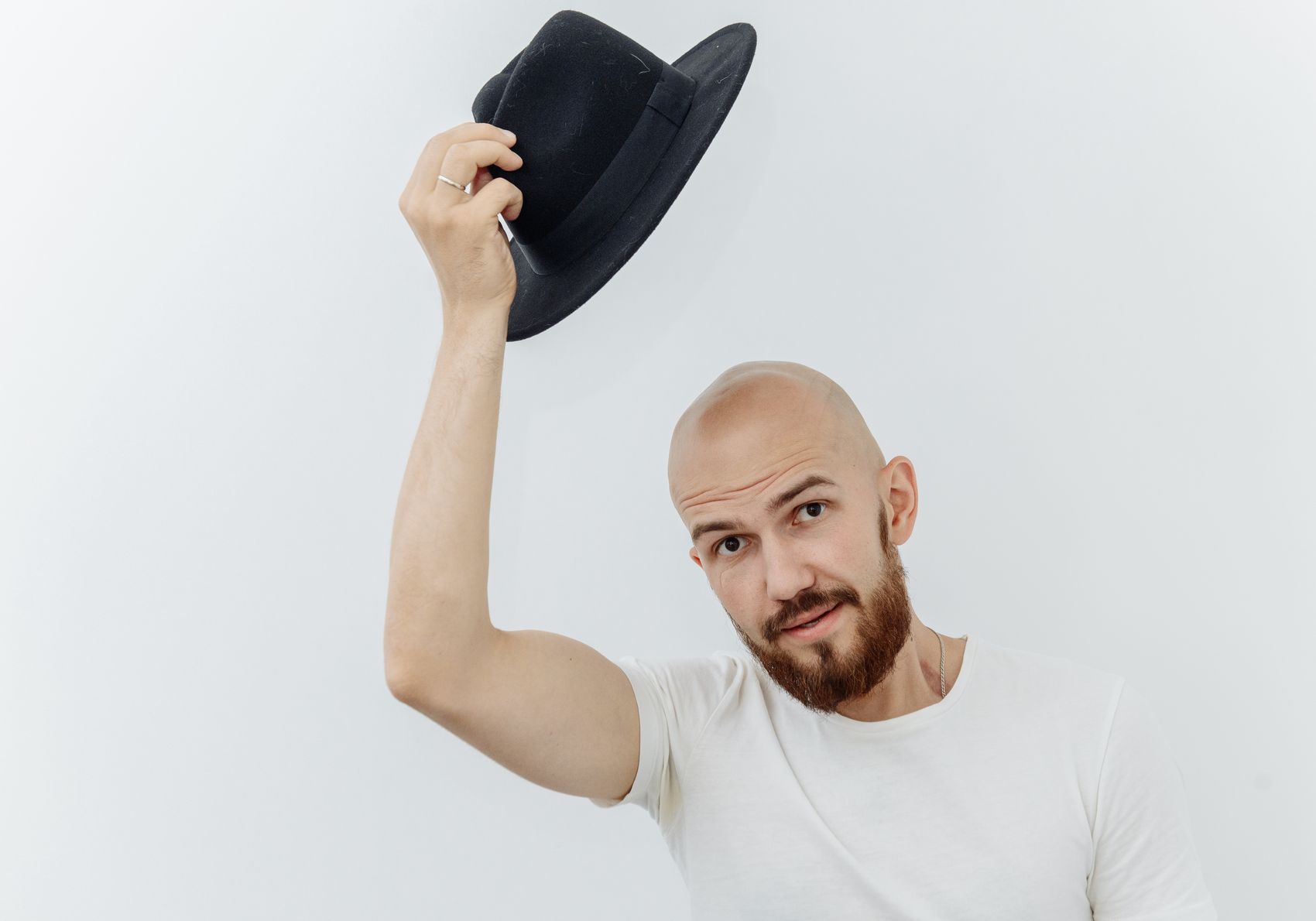 Patient wearing a loose hat safely after a hair transplant